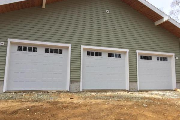 Three white shaker style doors with Madison Glass.